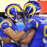 Los Angeles Rams wide receiver Cooper Kupp, left, celebrates after catching a touchdown pass from quarterback Matthew Stafford (9) during the second half of an NFL wild-card playoff football game against the Arizona Cardinals in Inglewood, Calif., Monday, Jan. 17, 2022. (AP Photo/Jae C. Hong)