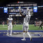 Dallas Cowboys wide receiver Ced Wilson (1) celebrates after catching a pass for a touchdown against the Arizona Cardinals during the second half of an NFL football game Sunday, Jan. 2, 2022, in Arlington, Texas. (AP Photo/Michael Ainsworth)