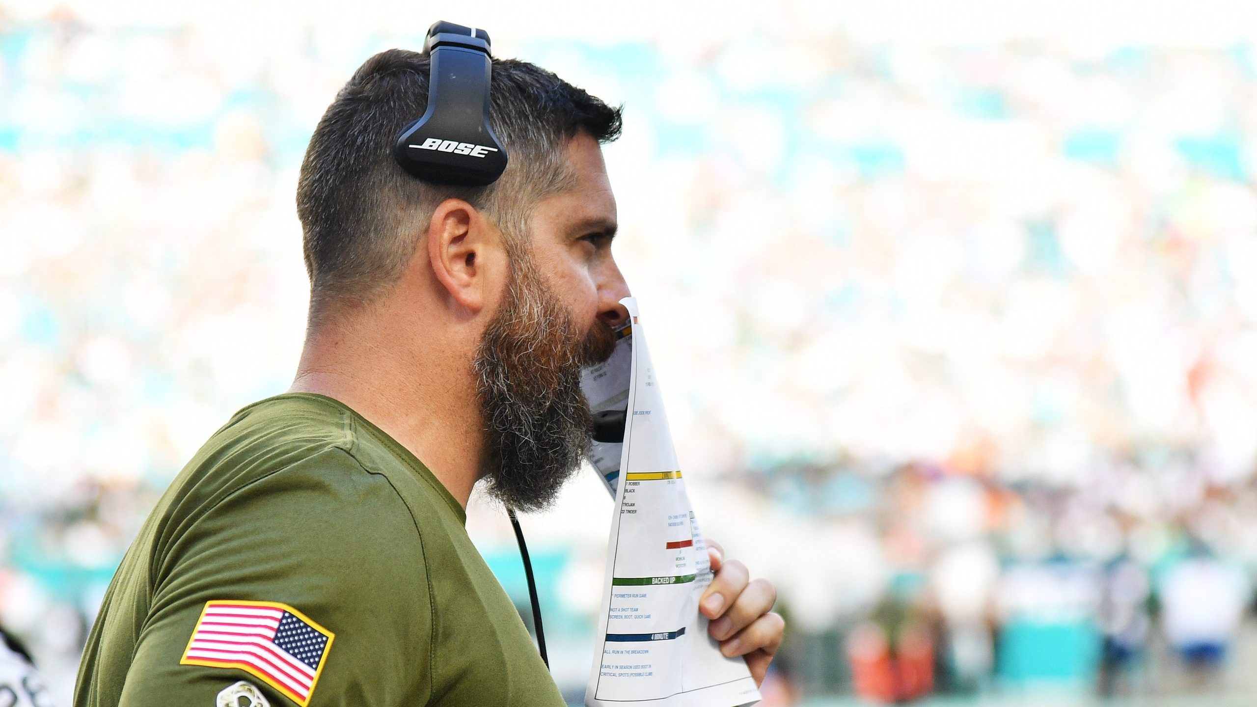 Defensive Coordinator Matt Burke of the Miami Dolphins looks on in the second half of their game ag...