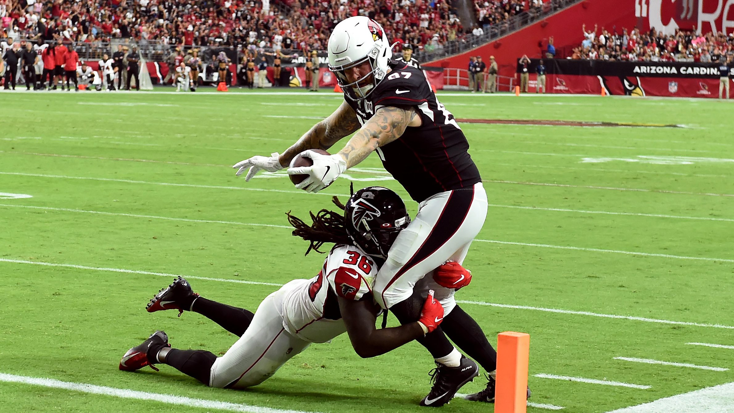 Maxx Williams #87 of the Arizona Cardinals stretches the ball over the goal line for a touchdown wh...