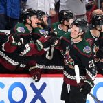 Barrett Hayton of the Arizona Coyotes celebrates with teammates on the bench after scoring a goal against the Winnipeg Jets during the first period at Gila River Arena on February 27, 2022 in Glendale, Arizona. (Photo by Norm Hall/NHLI via Getty Images)