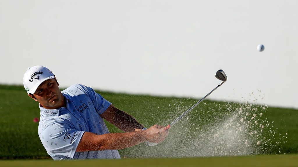 Jon Rahm of Spain chips to the 16th green during the first round of the Waste Management Phoenix Op...