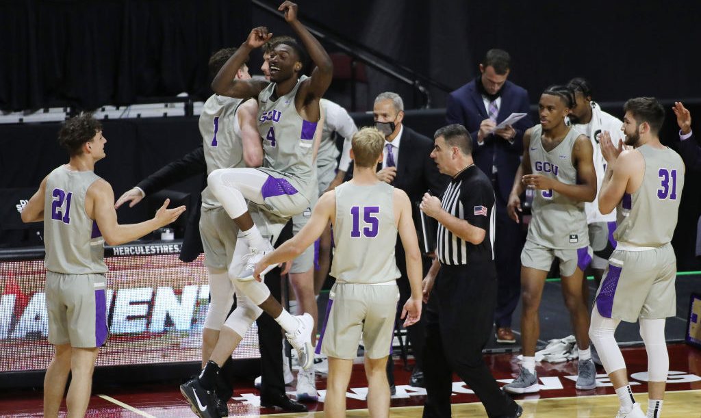 Oscar Frayer #4 of the Grand Canyon Lopes celebrates with his team after defeating the Seattle Univ...