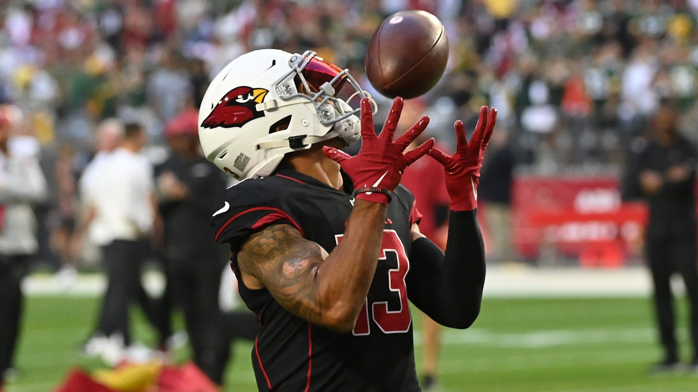 Christian Kirk #13 of the Arizona Cardinals participates in warmups prior to a game against the Gre...