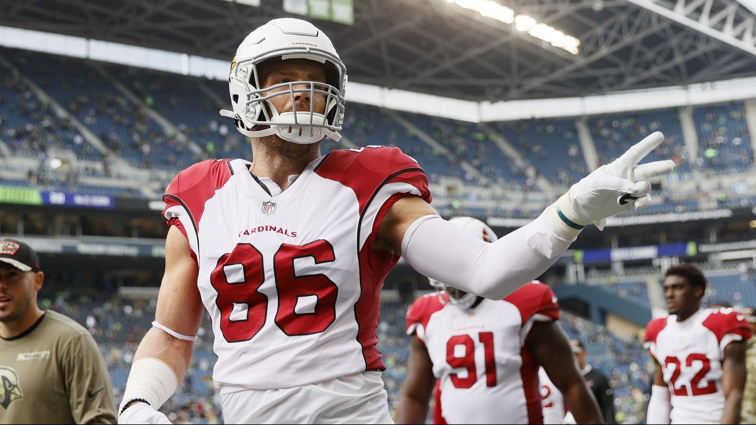 Zach Ertz #86 of the Arizona Cardinals signals to fans following the pregame warm-up before the gam...
