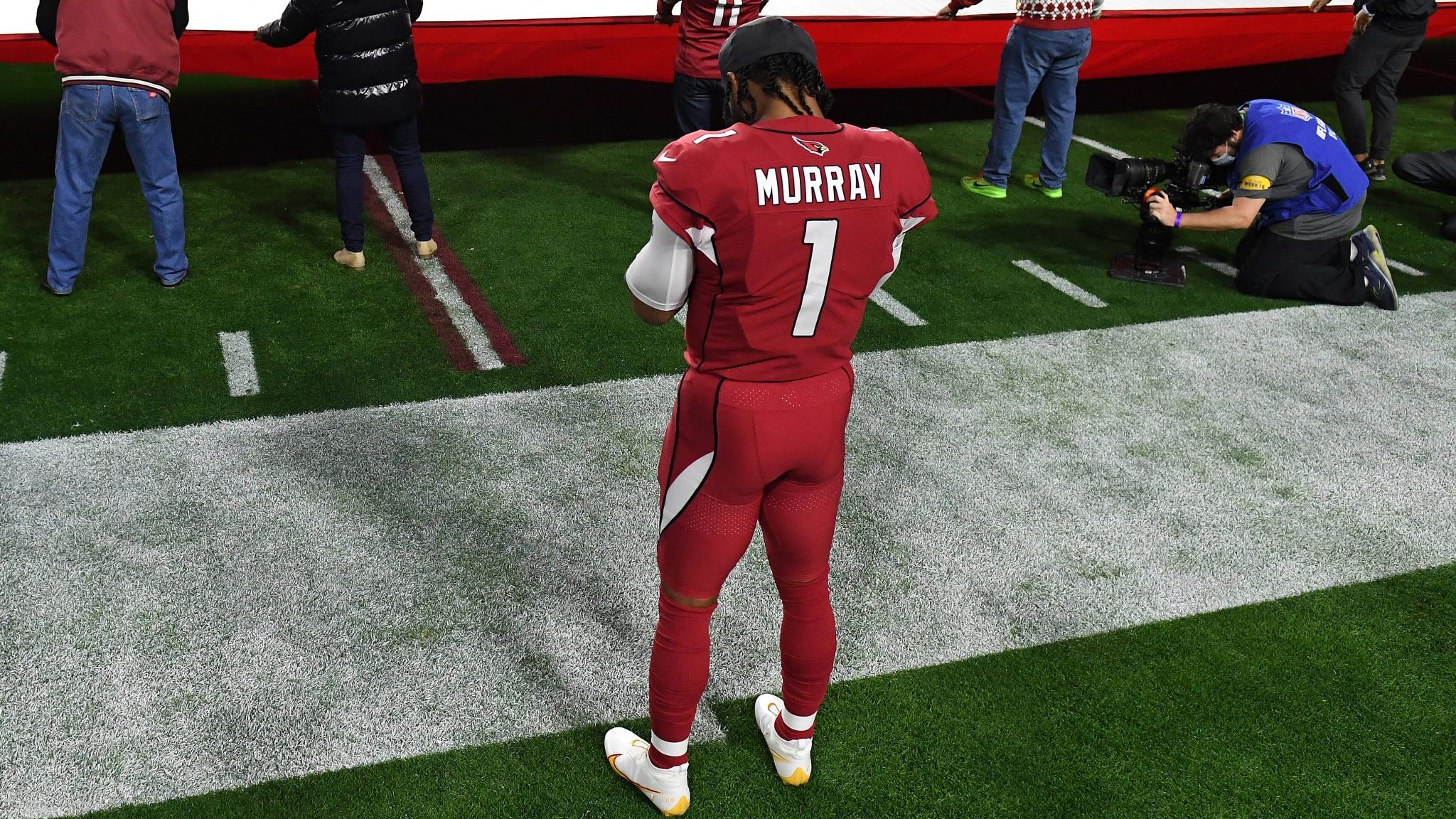 Kyler Murray #1 of the Arizona Cardinals observes the playing of the national anthem prior to the g...