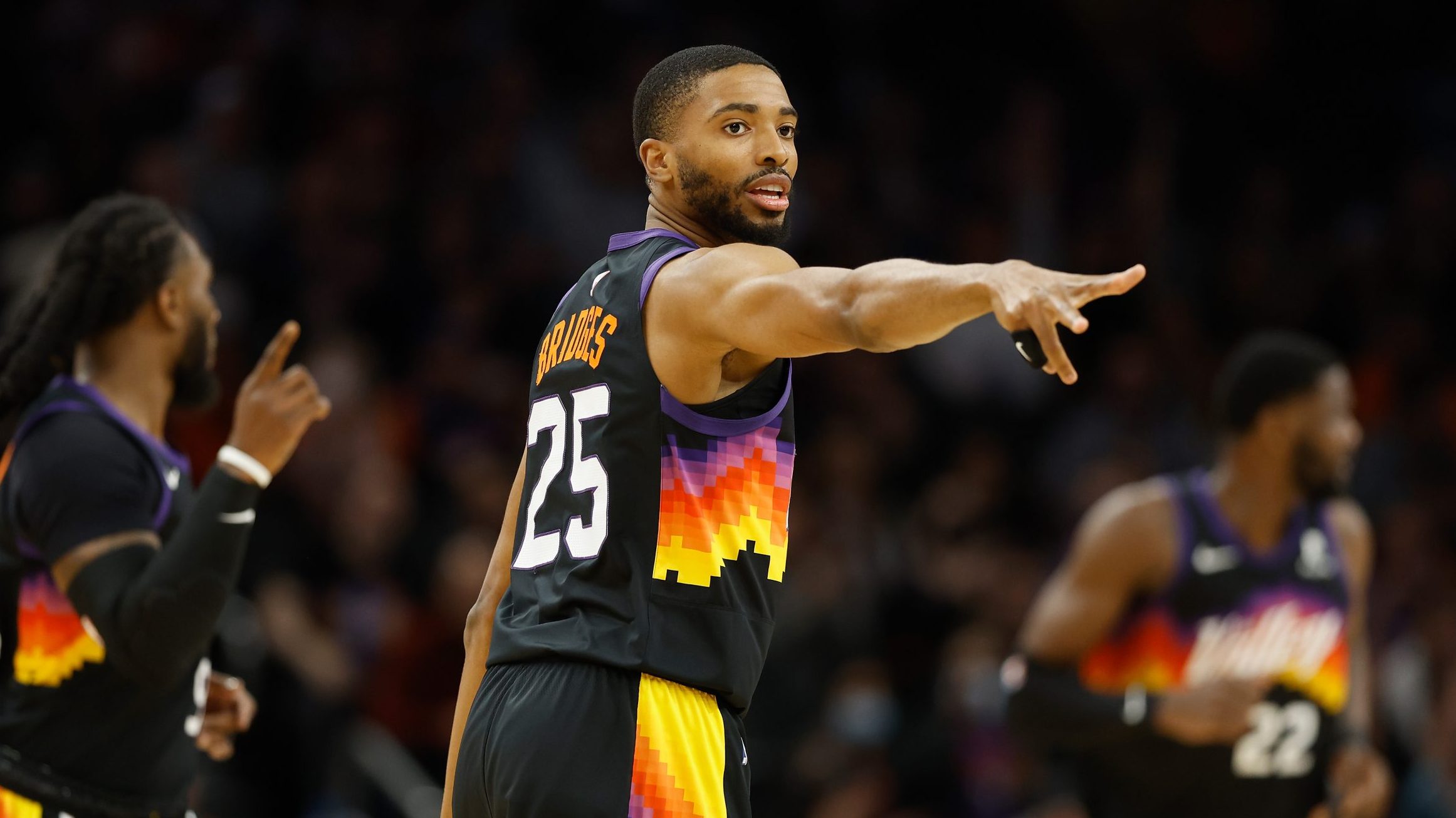 Mikal Bridges #25 of the Phoenix Suns reacts to a three-point shot against the Brooklyn Nets during...