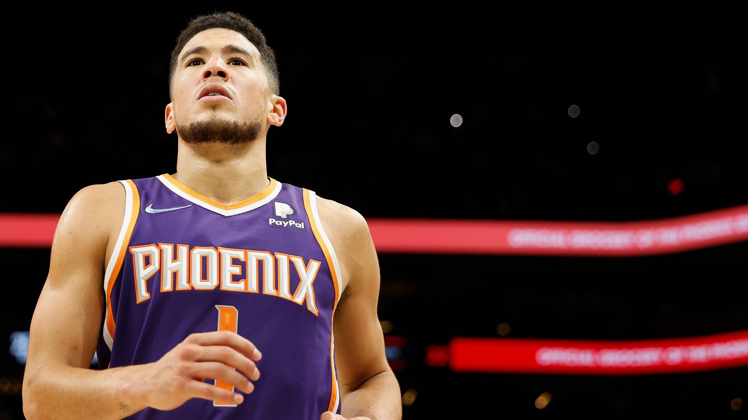 Devin Booker #1 of the Phoenix Suns reacts during the second half of the NBA game against the Houst...