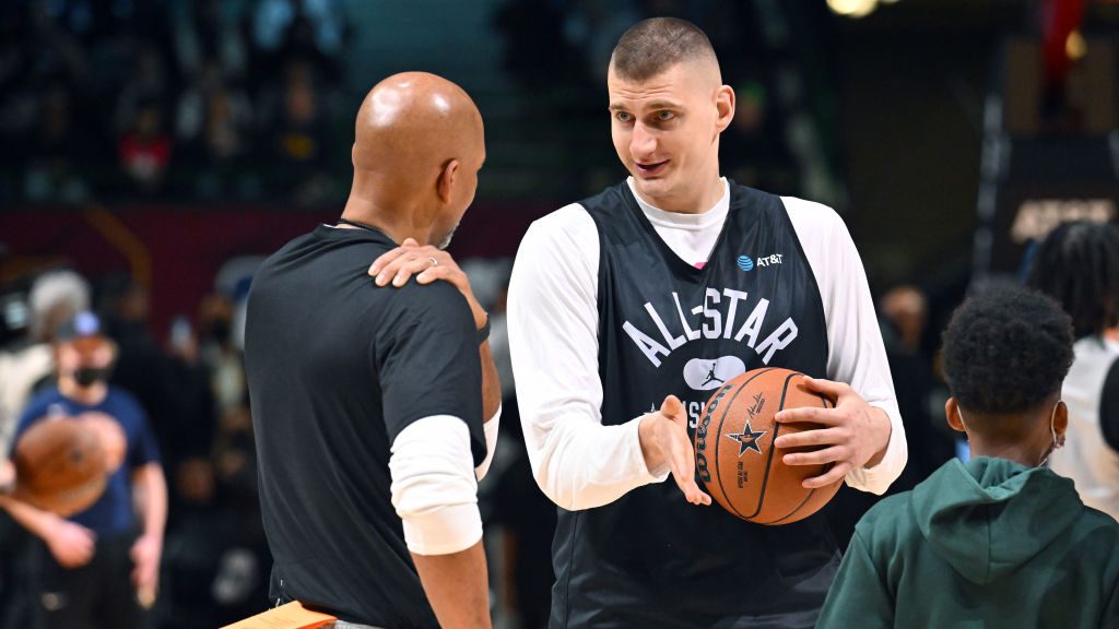 Nikola Jokic #15 talks with head coach Monty William during the NBA All-Star practice at the Wolste...