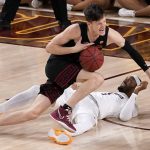 
              CORRECTS LOCATION TO TEMPE, INSTEAD OF PHOENIX - Southern California guard Drew Peterson fouls Arizona State guard Luther Muhammad, right, during the second half of an NCAA college basketball game, Thursday, Feb. 3, 2022, in Tempe, Ariz. (AP Photo/Matt York)
            