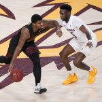 Southern California guard Ethan Anderson drives as Arizona State guard Jay Heath (5) defends during the second half of an NCAA college basketball game, Thursday, Feb. 3, 2022, in Phoenix. (AP Photo/Matt York)