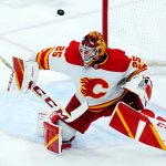 Calgary Flames goaltender Jacob Markstrom makes a save against the Arizona Coyotes during the first period of an NHL hockey game Wednesday, Feb. 2, 2022, in Glendale, Ariz. The Flames won 4-2. (AP Photo/Ross D. Franklin)