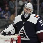 Colorado Avalanche goaltender Darcy Kuemper waits for play to resume during the second period of the team's NHL hockey game against the Arizona Coyotes on Tuesday, Feb. 1, 2022, in Denver. (AP Photo/David Zalubowski)