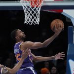 Phoenix Suns forward Mikal Bridges (25) shoots in the first half of an NBA basketball game against the Oklahoma City Thunder, Thursday, Feb. 24, 2022, in Oklahoma City. (AP Photo/Sue Ogrocki)
