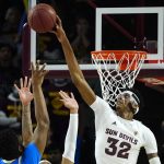 Arizona State forward Alonzo Gaffney (32) blocks a shot by UCLA forward Cody Riley (2) as Arizona State forward Jalen Graham, middle, defends during the second half of an NCAA college basketball game Saturday, Feb. 5, 2022, in Tempe, Ariz. Arizona State won in triple overtime 87-84. (AP Photo/Ross D. Franklin)