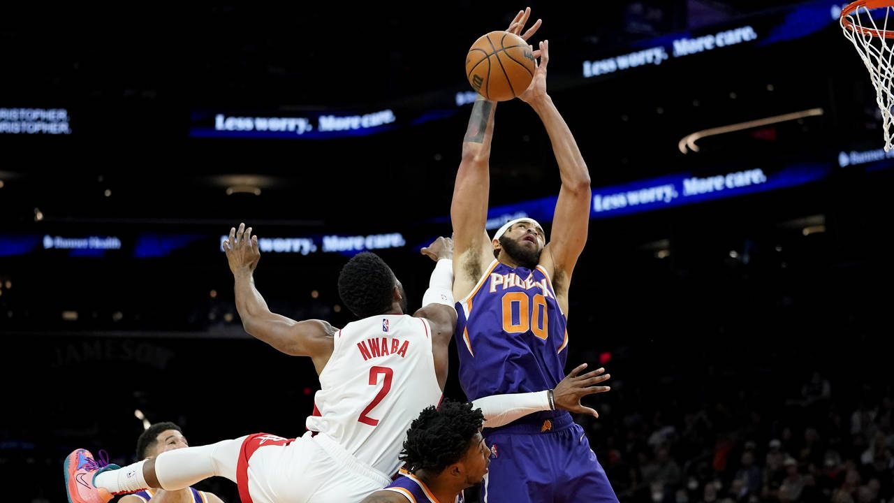Phoenix Suns center JaVale McGee (00) rebounds over Houston Rockets forward David Nwaba (2) during ...