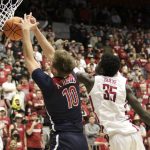 Arizona forward Azuolas Tubelis shoots the ball under pressure from Washington State forward Mouhamed Gueye (35) during the first half of an NCAA college basketball game, Thursday, Feb. 10, 2022, in Pullman, Wash. (AP Photo/Geoff Crimmins)