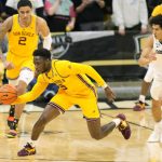Arizona State guard Jay Heath gathers in the ball in front of forward Jalen Graham, back, and Colorado guard KJ Simpson, right, during the first half of an NCAA college basketball game Thursday, Feb. 24, 2022, in Boulder, Colo. (AP Photo/David Zalubowski)