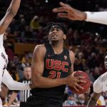 USC guard Reese Dixon-Waters (21) drives against Arizona State during the first half of an NCAA college basketball game, Thursday, Feb. 3, 2022, in Phoenix. (AP Photo/Matt York)