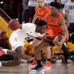 Arizona State guard Jay Heath (5) drives as Oregon State guard Dexter Akanno (3) defends during the first half of an NCAA college basketball game, Saturday, Feb. 19, 2022, in Tempe, Ariz. (AP Photo/Matt York)