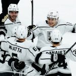 Los Angeles Kings left wing Viktor Arvidsson, second from left, celebrates his goal against the Arizona Coyotes with defenseman Matt Roy (3), defenseman Olli Maatta (6), center Phillip Danault (24) and center Trevor Moore (12) during the third period of an NHL hockey game Wednesday, Feb. 23, 2022, in Glendale, Ariz. The Kings won 3-2. (AP Photo/Ross D. Franklin)