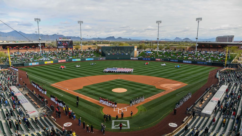 An overhead view of the Oakland Athletics and Arizona Diamondbacks as they stand for the national a...