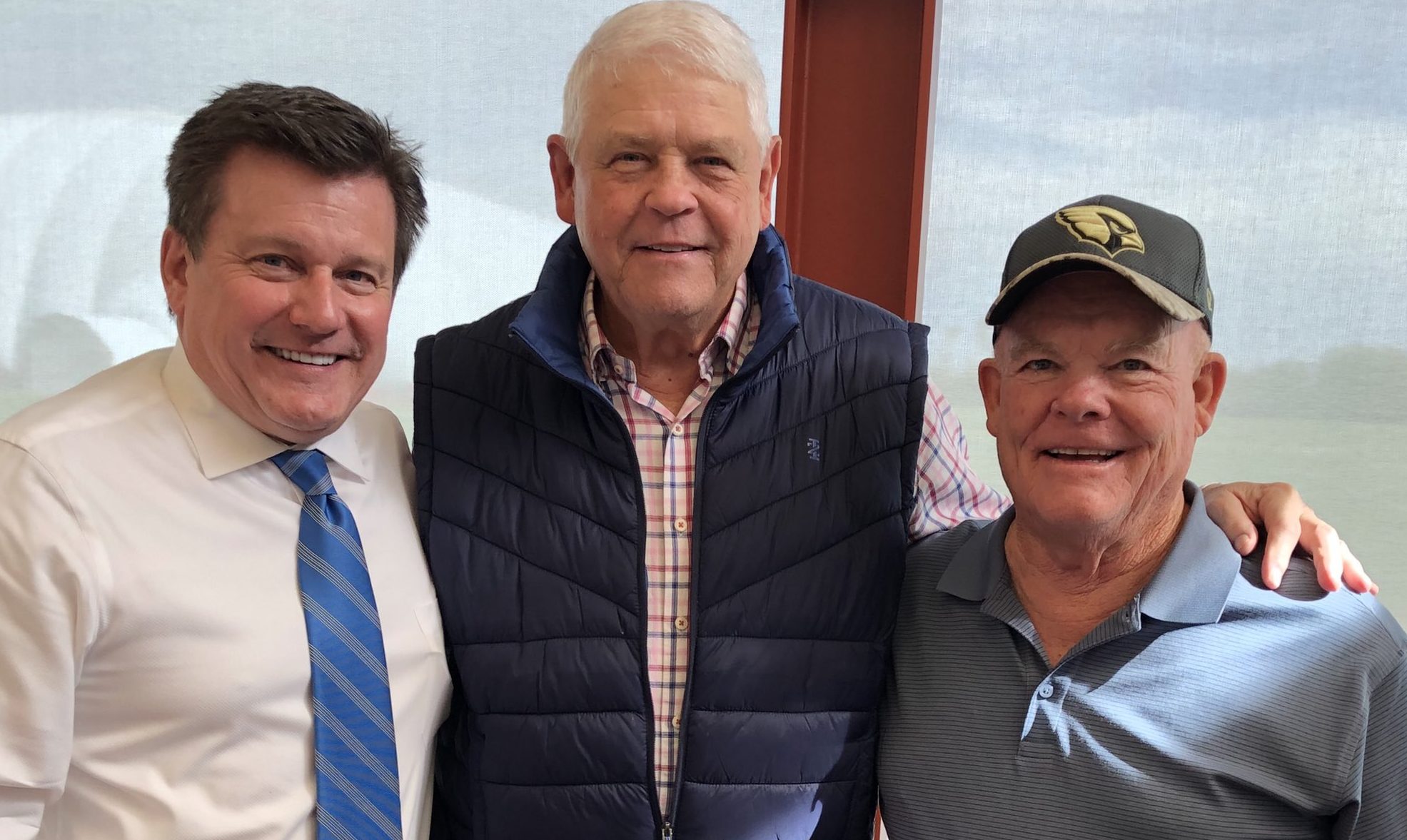 From left to right, Cardinals owner Michael Bidwill, former QB Jim Hart and former trainer John Omo...