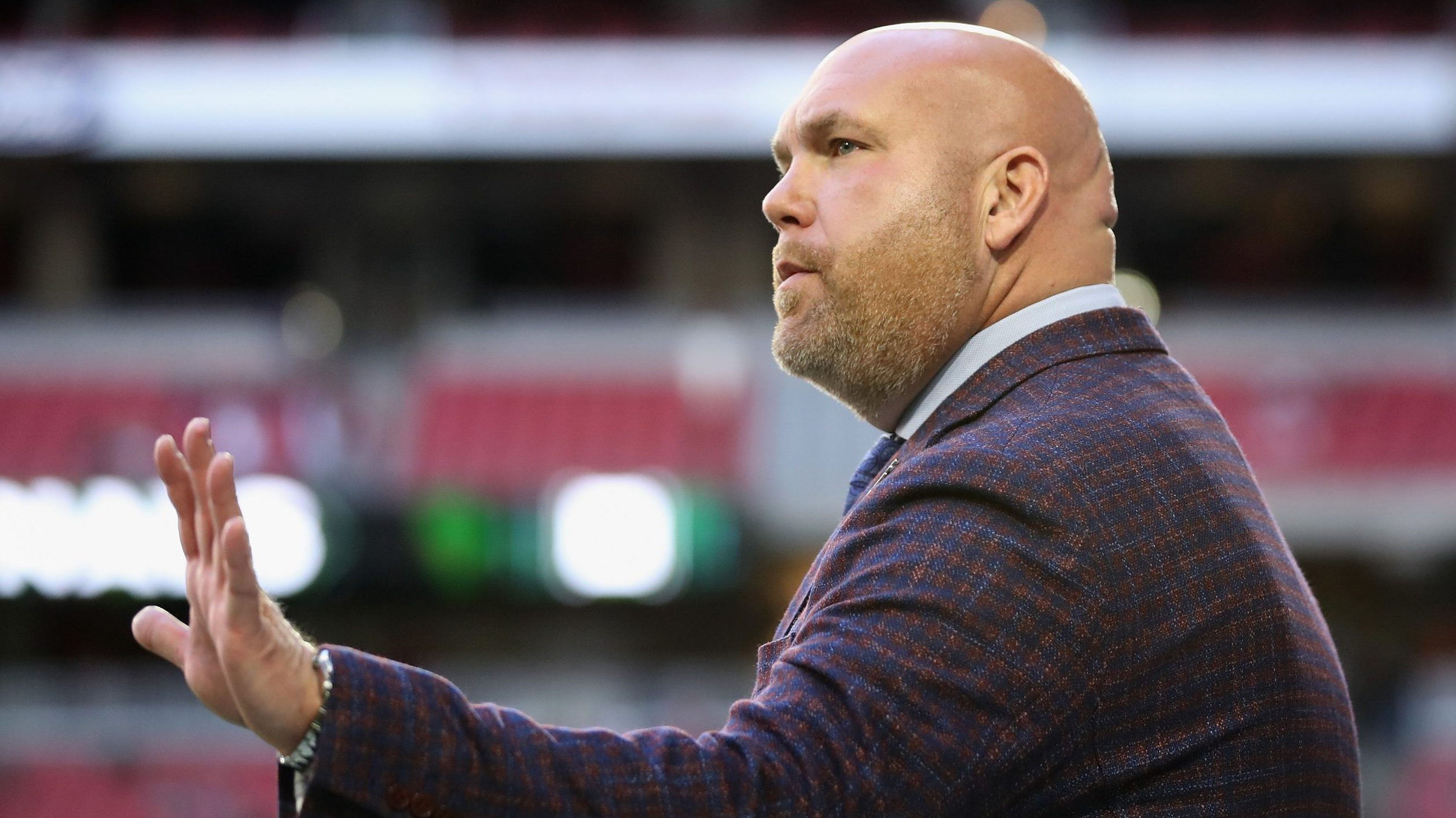General manager Steve Keim of the Arizona Cardinals waves to fans during the first half of the NFL ...