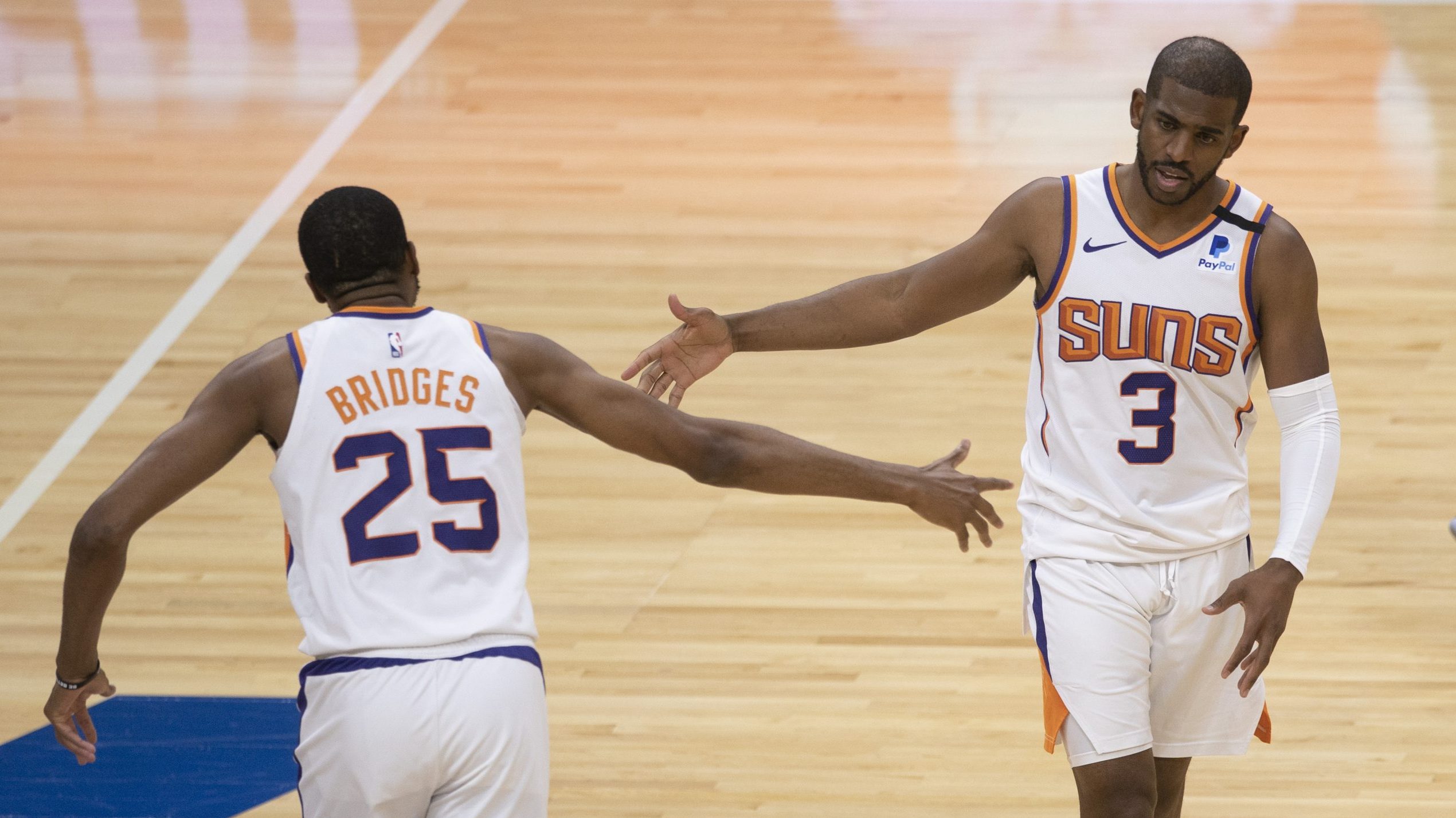 Mikal Bridges #25 of the Phoenix Suns celebrates with Chris Paul #3 against the Philadelphia 76ers ...