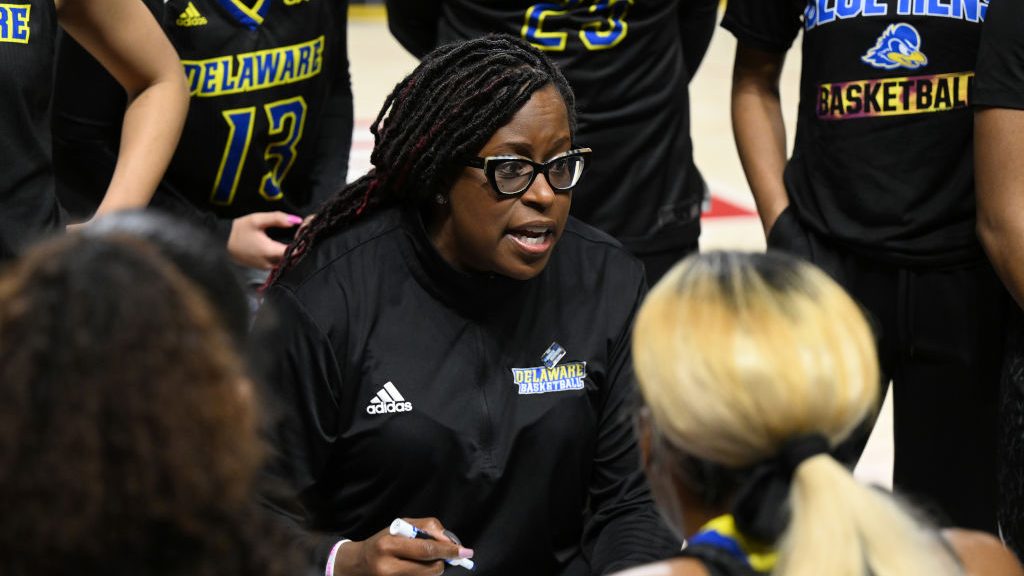 Head coach Natasha Adair of the Delaware Blue Hens talks to her team during the game against the Ma...
