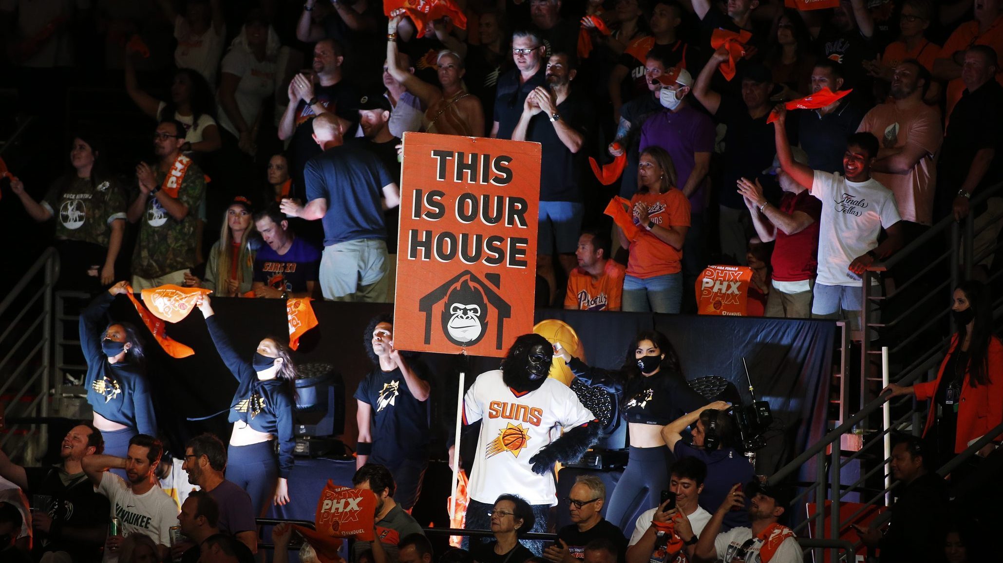 Phoenix Suns fans cheer after the team's win against the Milwaukee Bucks in Game Two of the NBA Fin...