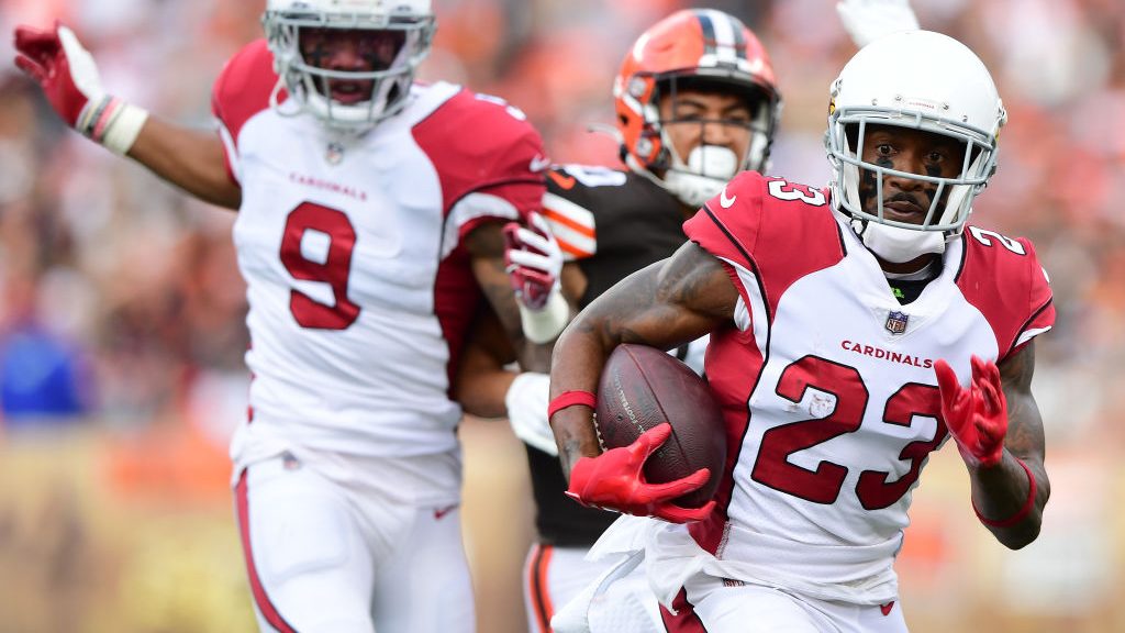 Robert Alford #23 of the Arizona Cardinals runs with the ball after an interception during the seco...