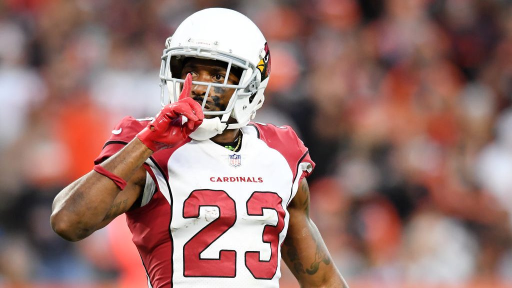 Robert Alford #23 of the Arizona Cardinals signals to the crowd after a fourth down stop during the...