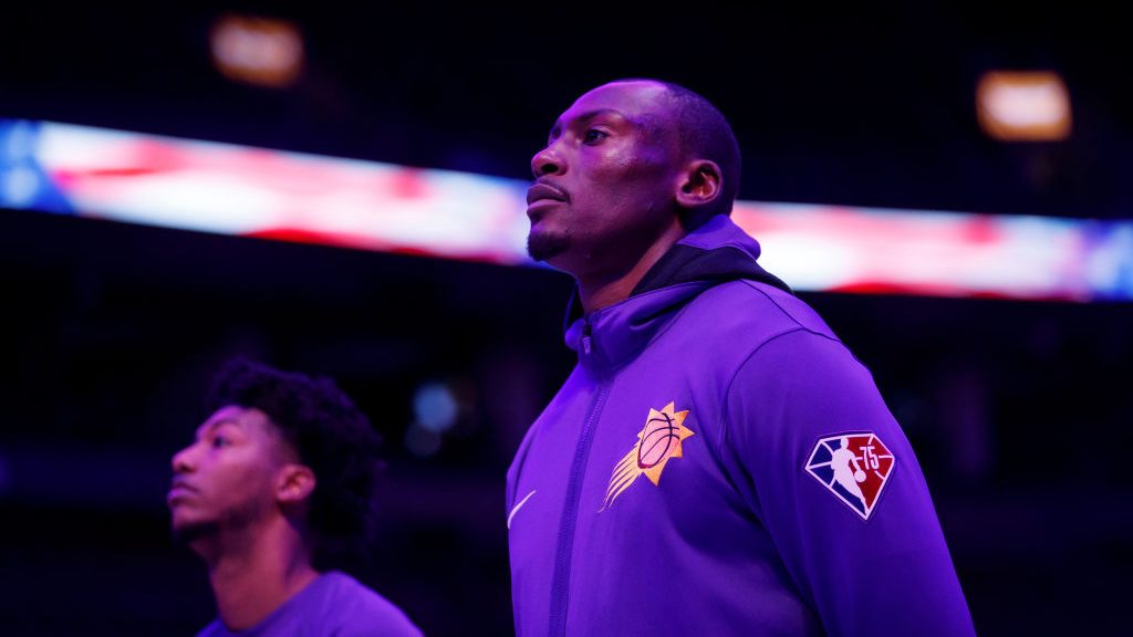 Bismack Biyombo #18 of the Phoenix Suns, stands for the American national anthem ahead of their NBA...