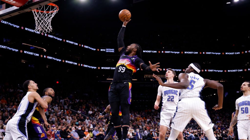 Jae Crowder #99 of the Phoenix Suns dunks over Mo Bamba #5 of the Orlando Magic  during the first h...