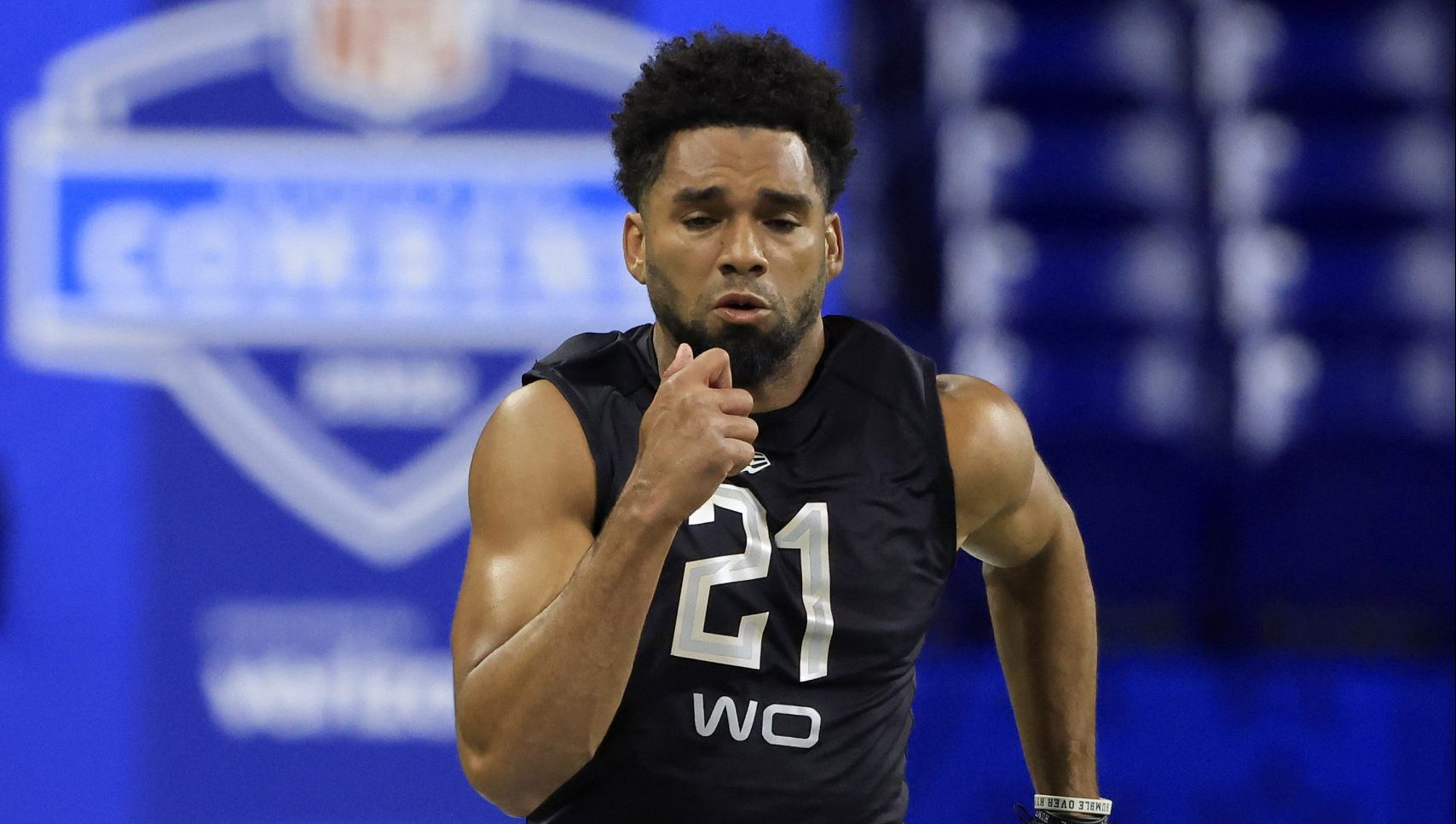 Chris Olave #WO21 of Ohio State runs the 40 yard dash during the NFL Scouting Combine at Lucas Oil ...