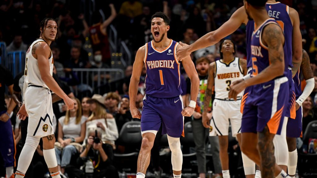 Devin Booker (1) of the Phoenix Suns lets out a primal roar after he grabbed an offensive rebound f...