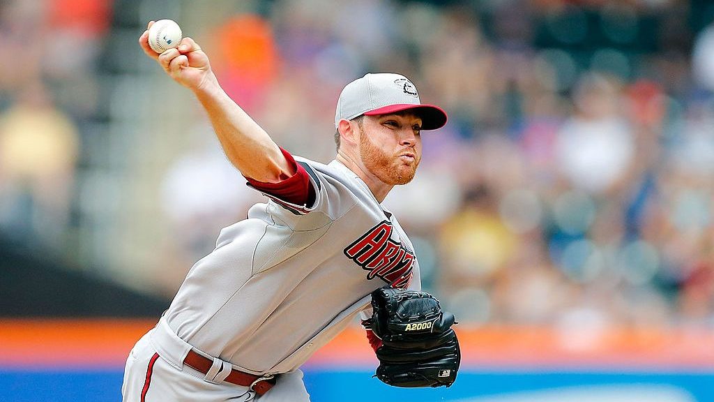 Ian Kennedy #31 of the Arizona Diamondbacks delivers a pitch against the New York Mets at Citi Fiel...
