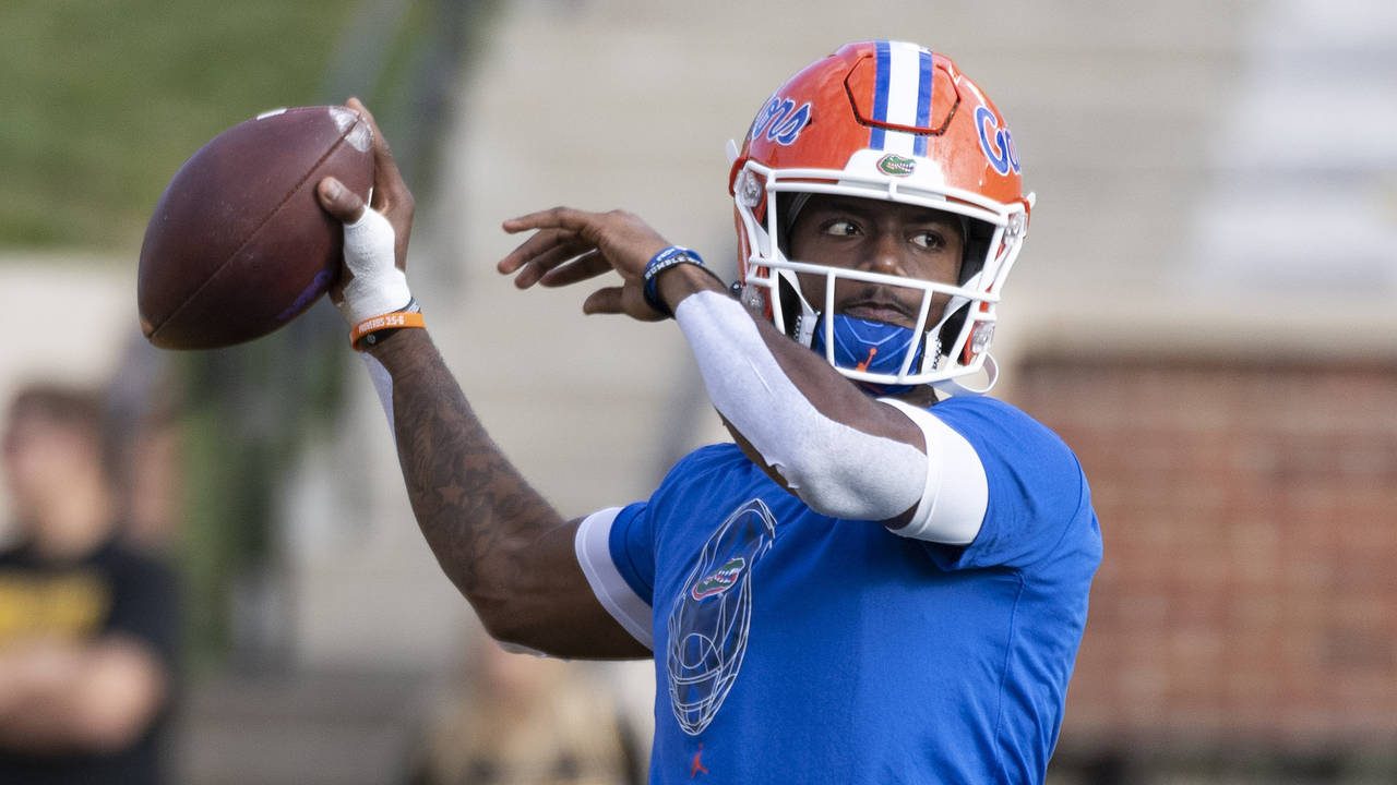 FILE - Florida quarterback Emory Jones warms up for the team's NCAA college football game against M...