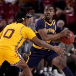 California guard Makale Foreman looks to pass as Arizona State guard DJ Horne (0) defends during the first half of an NCAA college basketball game, Thursday, March 3, 2022, in Tempe, Ariz. (AP Photo/Matt York)
