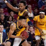 California guard Jordan Shepherd is pressured by Arizona State forward Kimani Lawrence, right, during the first half of an NCAA college basketball game, Thursday, March 3, 2022, in Tempe, Ariz. (AP Photo/Matt York)