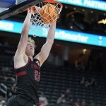 Stanford's James Keefe (22) dunks against Arizona State during the second half of an NCAA college basketball game in the first round of the Pac-12 tournament Wednesday, March 9, 2022, in Las Vegas. (AP Photo/John Locher)