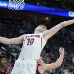 Arizona's Azuolas Tubelis (10) grabs a rebound against Stanford during the second half of an NCAA college basketball game in the quarterfinal round of the Pac-12 tournament Thursday, March 10, 2022, in Las Vegas. (AP Photo/John Locher)