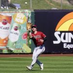 Arizona Diamondbacks right fielder Jake McCarthy reaches up to catch a fly ball hit by San Francisco Giants' Joc Pederson during the second inning of a spring training baseball game Wednesday, March 23, 2022, in Scottsdale, Ariz. (AP Photo/Ross D. Franklin)