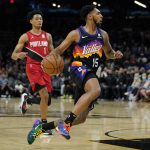 Phoenix Suns guard Cameron Payne (15) drives against the Portland Trail Blazers during the second half of an NBA basketball game, Wednesday, March 2, 2022, in Phoenix. (AP Photo/Matt York)