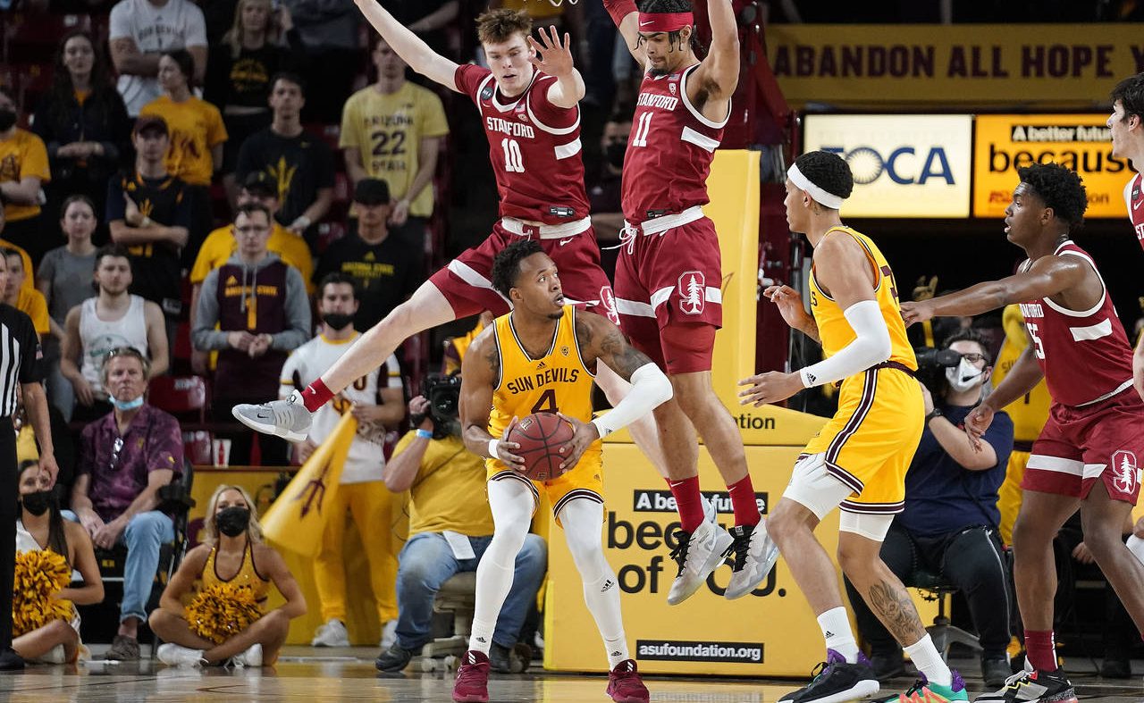 Arizona State's Kimani Lawrence (4) gets double-teamed by Stanford's Max Murrell (10) and Jaiden De...