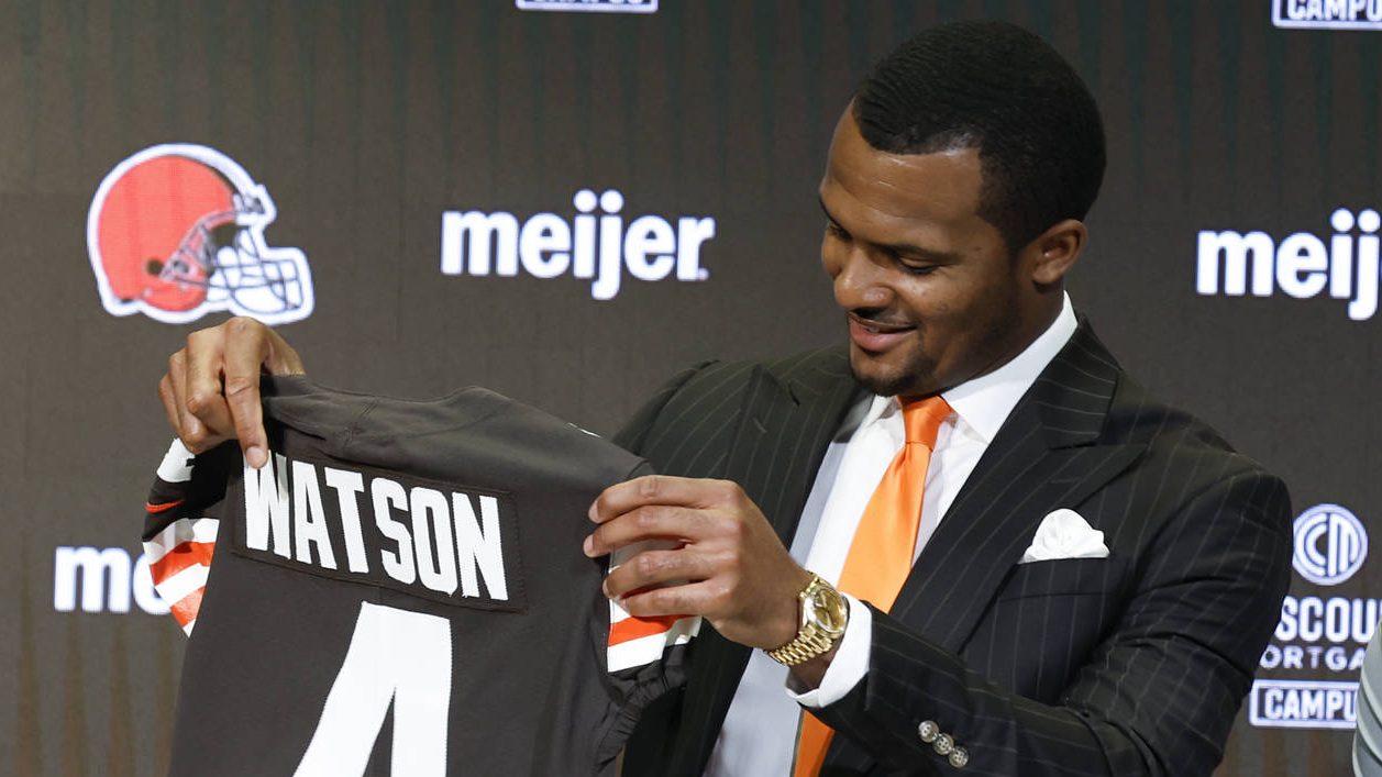 Cleveland Browns new quarterback Deshaun Watson holds his jersey during a news conference at the NF...