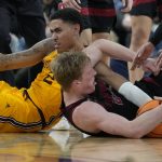 Arizona State's Jalen Graham (2) and Stanford's James Keefe (22) scramble for the ball during the second half of an NCAA college basketball game in the first round of the Pac-12 tournament Wednesday, March 9, 2022, in Las Vegas. (AP Photo/John Locher)