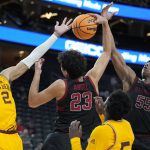 From left, Arizona State's Jalen Graham (2), Stanford's Brandon Angel (23) and Harrison Ingram (55) battle for a rebound during the second half of an NCAA college basketball game in the first round of the Pac-12 tournament Wednesday, March 9, 2022, in Las Vegas. (AP Photo/John Locher)