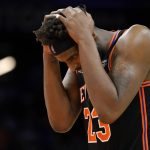 New York Knicks center Mitchell Robinson (23) reacts to a call during the second half of an NBA basketball game against the Phoenix Suns, Friday, March 4, 2022, in Phoenix. The Phoenix Suns defeated the Knicks 115-114. (AP Photo/Matt York)